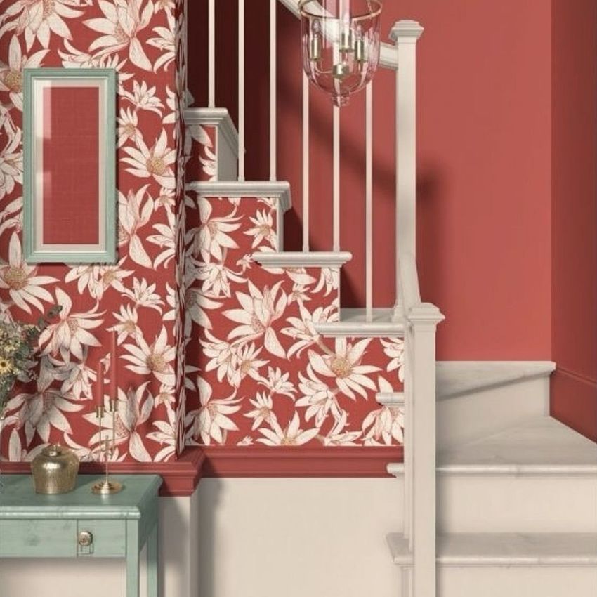 Traditional staircase mockup featuring white steps and railing, with red floral wallpaper and a framed accent on the wall.