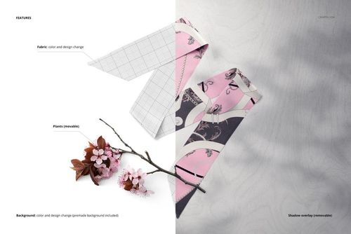 Top view of a twilly scarf mockup with pink floral patterns, next to cherry blossom branches on a light surface.