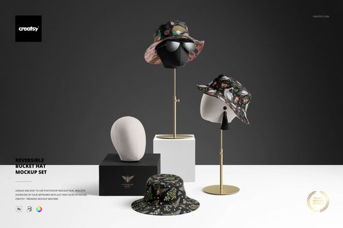PSD mockup of adult bucket hats with nature-inspired prints, arranged on display stands and a black box in a studio setting.