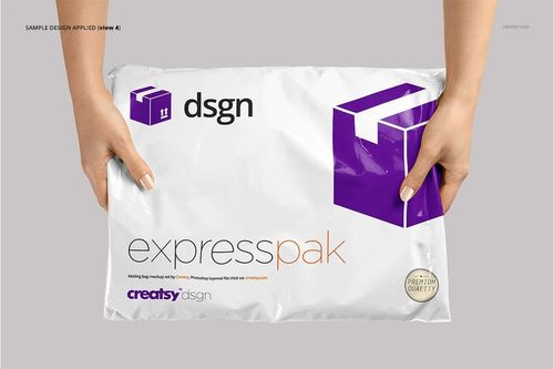 Front view of a white mailing bag mockup featuring purple graphics and text, held by hands, on a plain backdrop.