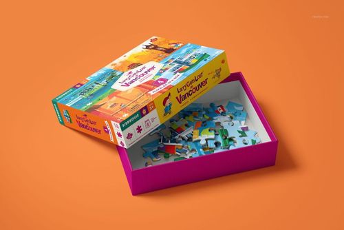Puzzle game box mockup featuring a partially assembled jigsaw puzzle inside, displayed at a diagonal angle on an orange surface.