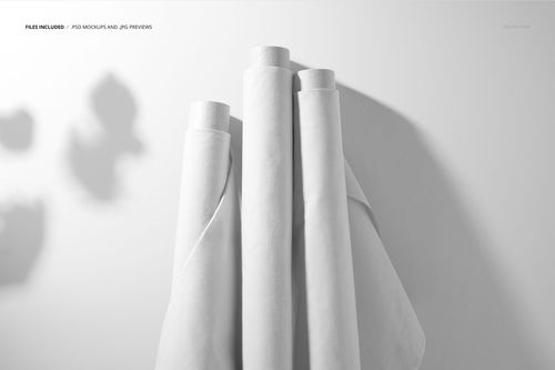 White textile rolls displayed upright in a minimal scene, highlighting the PSD mockup's clean and simple presentation.