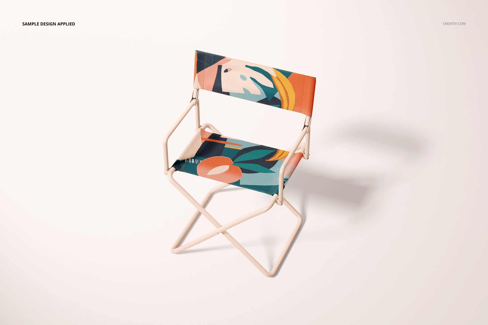Front angled view of a folding directors chair mockup featuring colorful abstract shapes on the seat and backrest.
