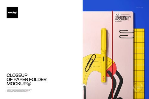 Close-up of a paper folder mockup with abstract colorful design, yellow pen, paper clips, and grid notebook.