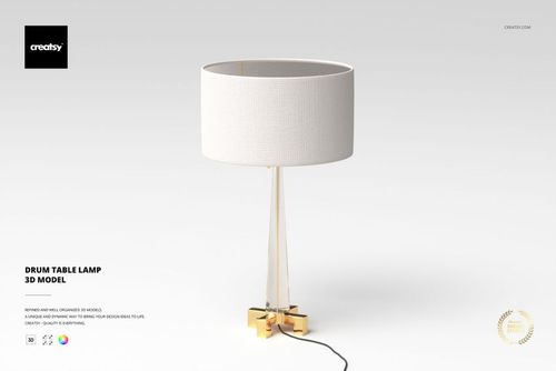 Modern drum table lamp with a cylindrical white fabric shade and gold metal base, front view on a plain background.
