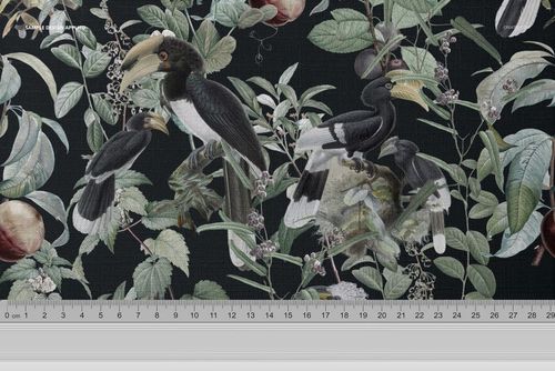 Close-up of tablecloth fabric mockup featuring hornbill birds and leafy branches on a dark background, ruler visible below.