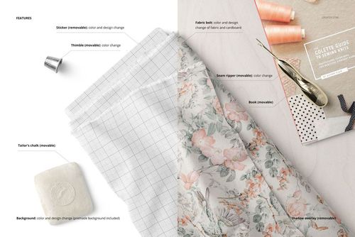 PSD mockup showing a fabric bolt with floral print and grid design, alongside sewing tools and a book on a tabletop.