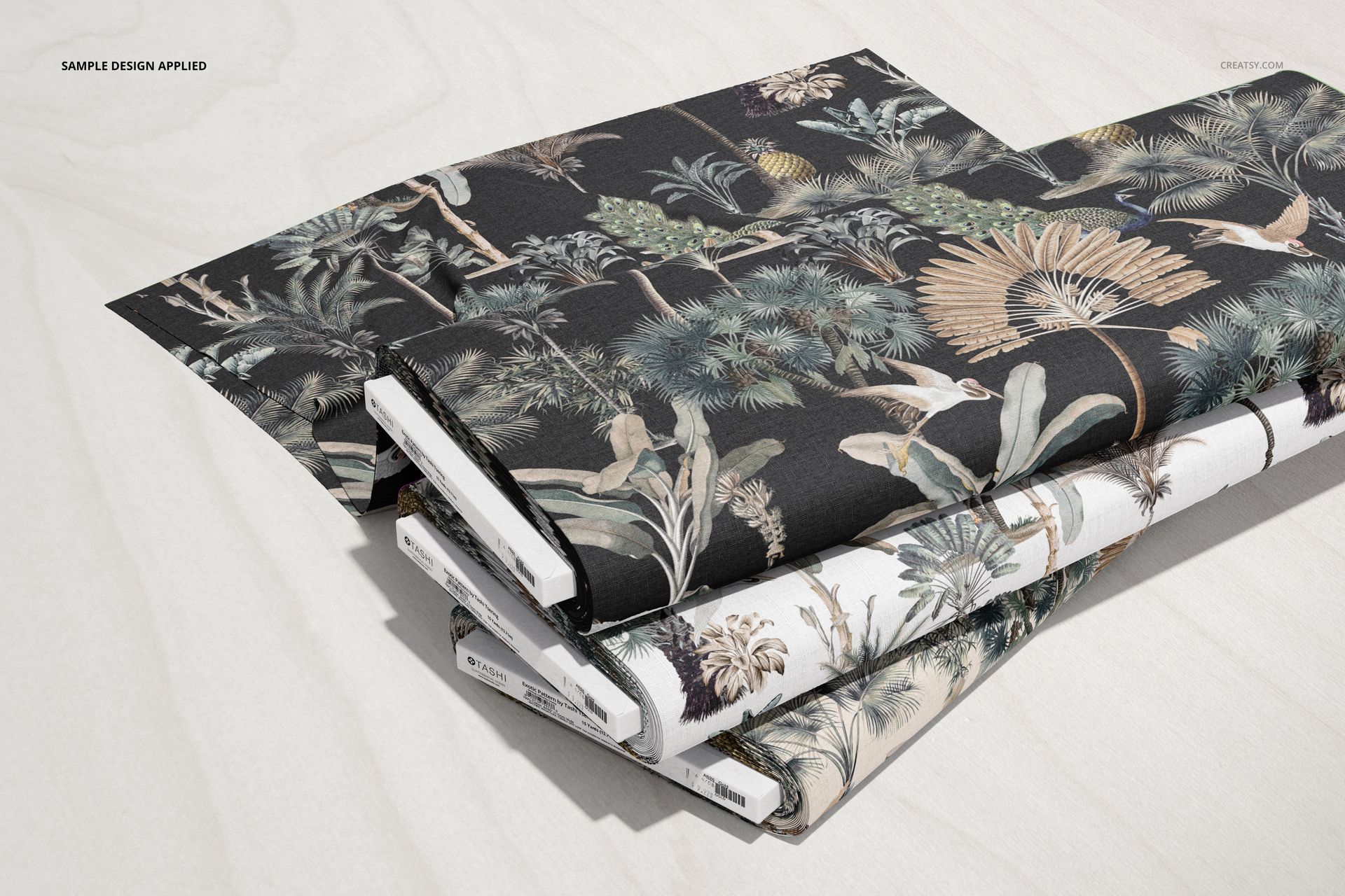 Fabric bolts mockup set with nature-themed prints, arranged diagonally on a pale wooden background in a realistic PSD mockup.