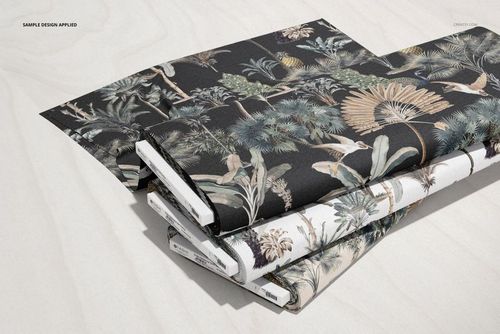 Fabric bolts mockup set with nature-themed prints, arranged diagonally on a pale wooden background in a realistic PSD mockup.