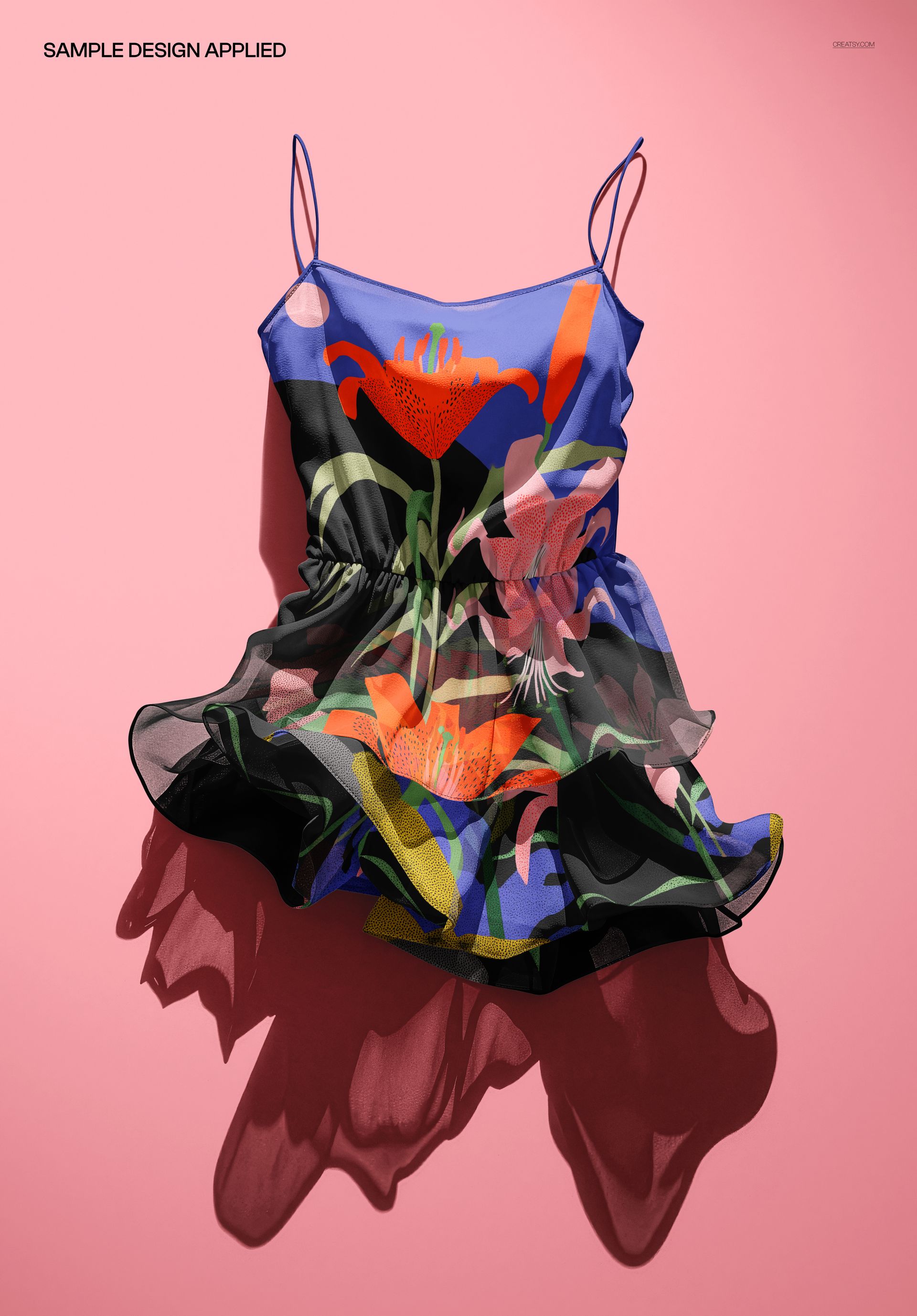 Ruffled sheer summer dress mockup with spaghetti straps, floral print, and ghosted flatlay on a pink background.