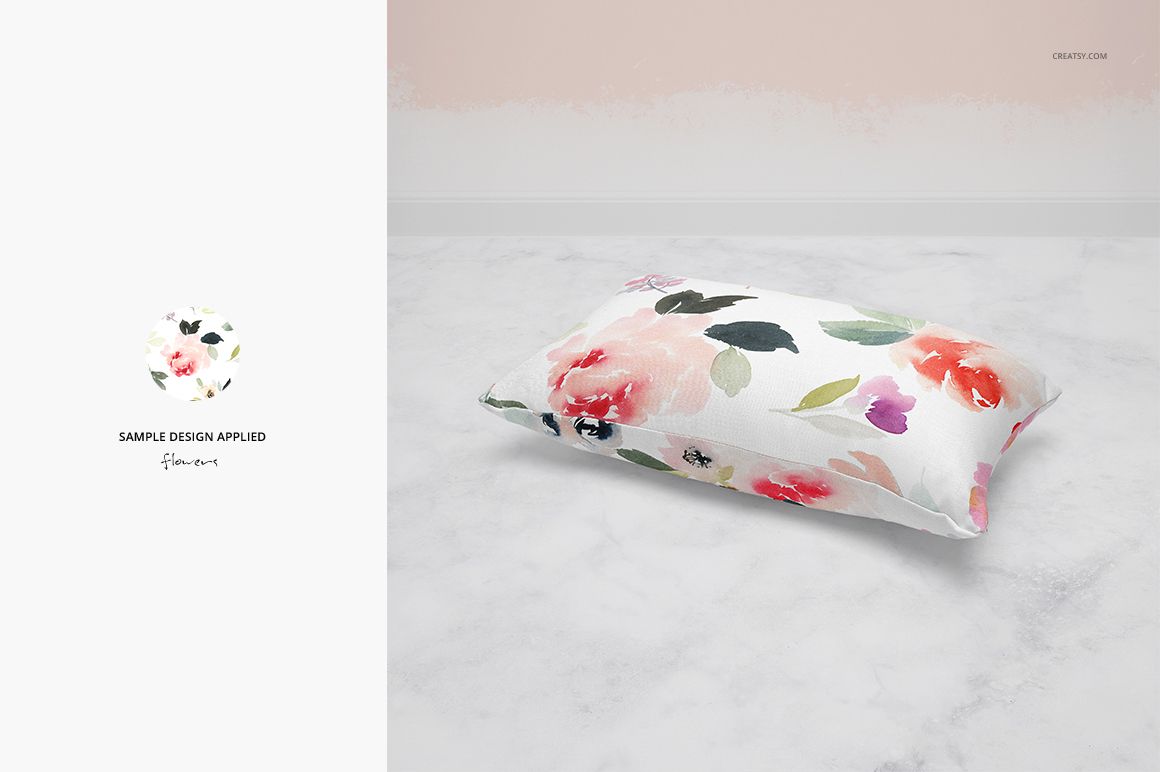 Rectangular pillow mockup featuring soft floral design in pastel colors, displayed on a light marble surface.