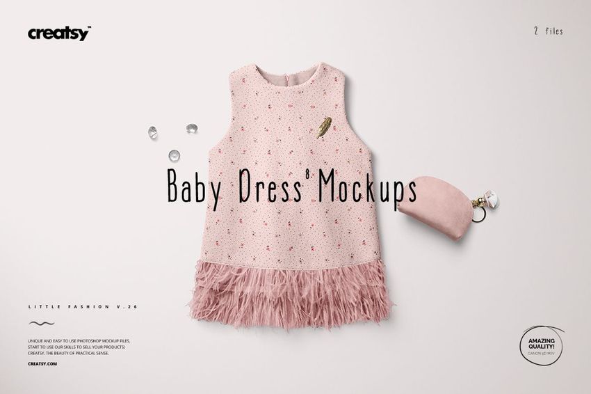 Front view of a sleeveless baby dress mockup in soft pink with tiny dot pattern and feathered hem, set on a light background.