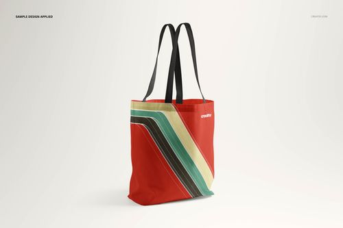 Tote bag mockup displayed upright with a bold red base and multicolored diagonal stripe pattern, isolated on white.