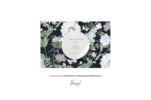 PSD mockup featuring two grosgrain ribbons and assorted sewing tools on a floral fabric backdrop, top perspective.
