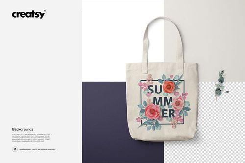 Front view of a polyester tote bag mockup featuring a floral design and text, displayed on a color-block background.