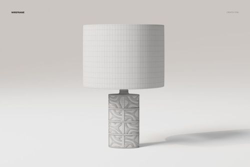 Front view of a decorative table lamp with a cylindrical base featuring geometric patterns and a plain white lampshade.