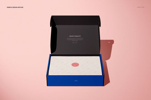 Open mailing box mockup with a blue exterior, black lid, and patterned inner packaging on a light pink surface.