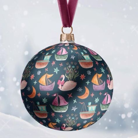 Satin Christmas ball mockup with a velvet ribbon, featuring a colorful boat and moon pattern on a dark background, hanging in a snowy scene.