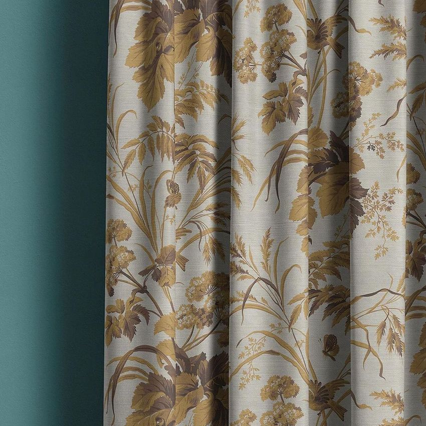 Curtain mockup featuring a close-up view of fabric with a beige and brown floral pattern against a teal wall.