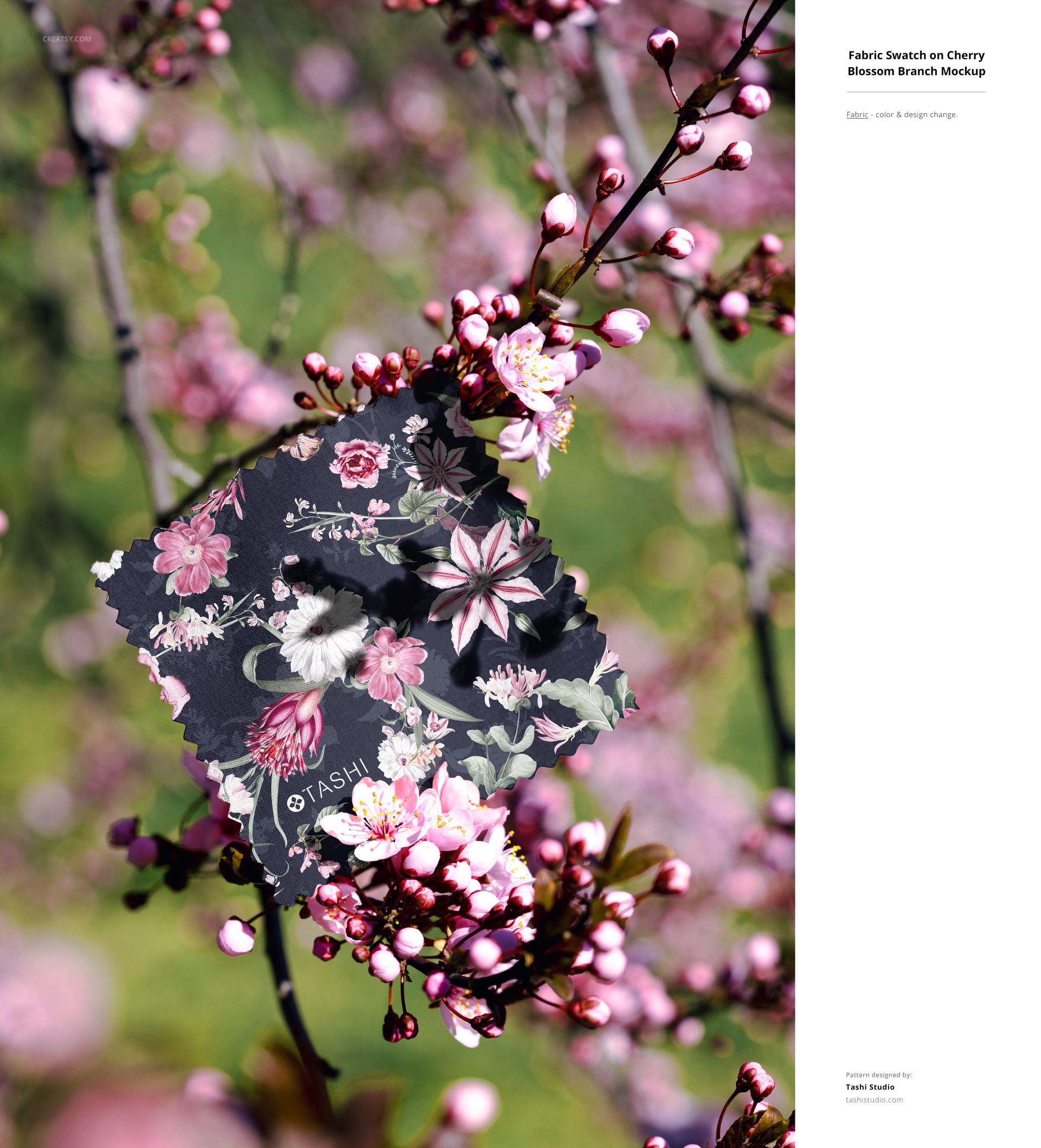 PSD mockup showing a dark floral fabric sample placed among pink cherry blossoms in a natural outdoor setting.