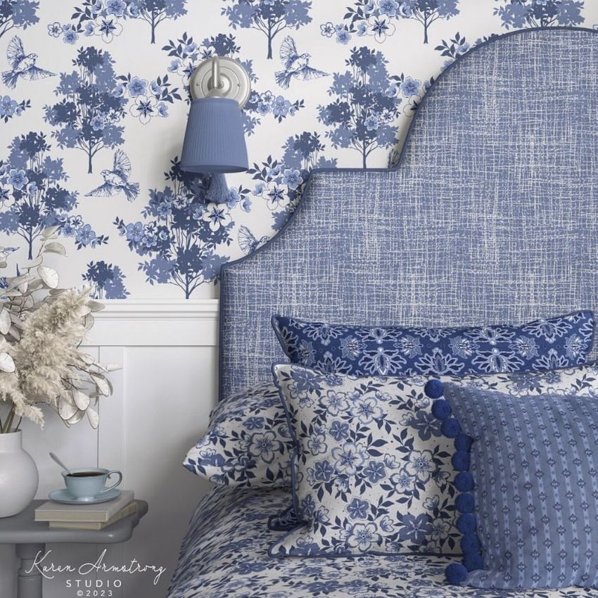 Bedroom pillows, headboard, and wallpaper mockup showing a blue patterned headboard, floral bedding, and botanical wallpaper.
