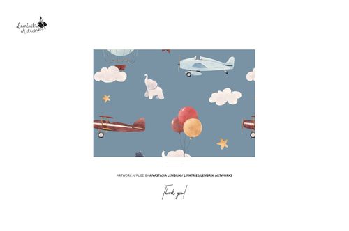 Front view of a baby toddler fleece onesie mockup with a blue background featuring airplanes, balloons, clouds, and elephants.