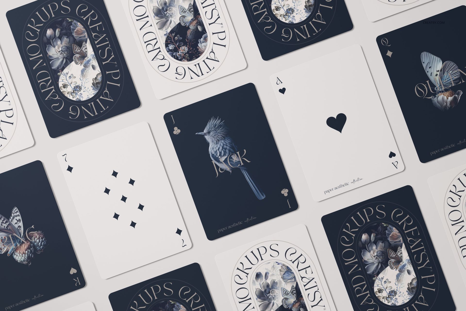 PSD mockup of playing cards laid out flat, displaying a mix of illustrated and minimalistic card faces in blue and white tones.