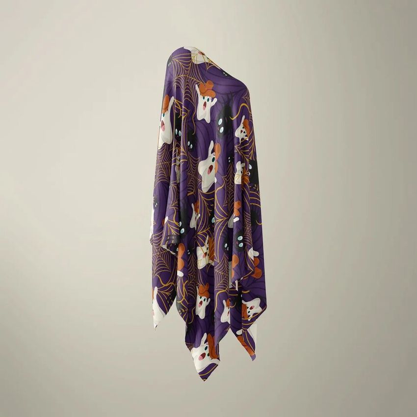 Halloween fabric mockup featuring a draped cloth with a purple background, ghost illustrations, and cobweb patterns.