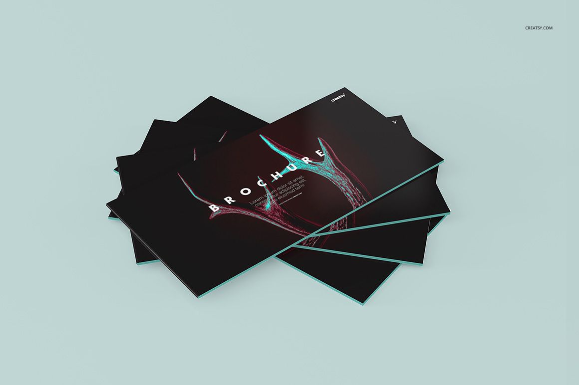 Brochure mockup set displayed on a light blue background, showcasing dark covers with vivid graphic accents and text.