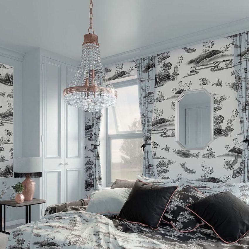 Luxury bedroom mockup featuring patterned wallpaper, a crystal chandelier, and a bed with layered pillows and a floral duvet.
