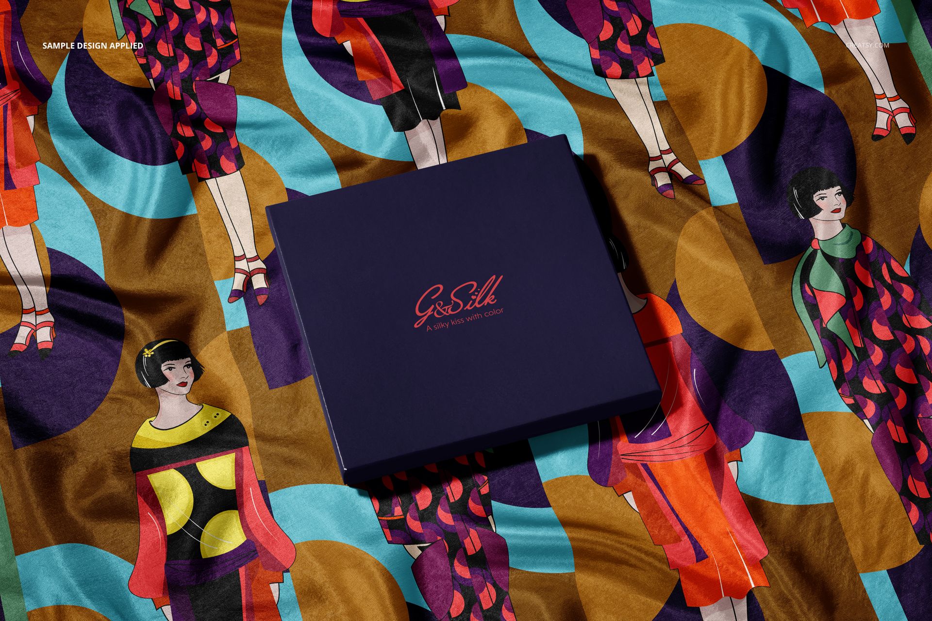 PSD mockup of a fashion accessory set displaying a patterned silk scarf and a matching dark blue presentation box.