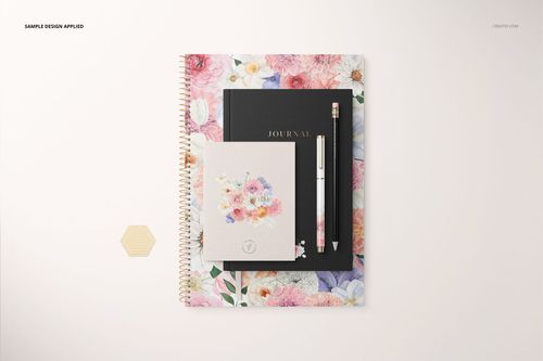 Stationery set mockup featuring a spiral notebook with colorful floral cover, black journal, card, pencil, and pen arranged neatly.