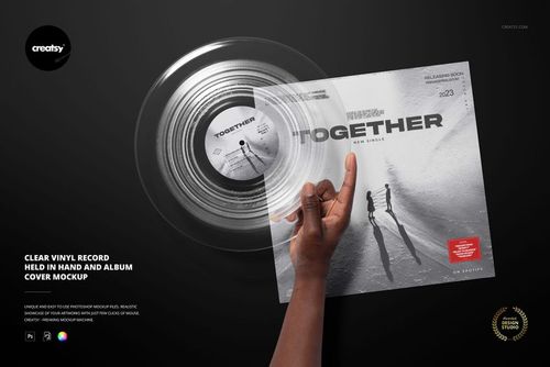 PSD mockup showing a clear vinyl record in hand with a stylish album cover, both placed against a dark scene.