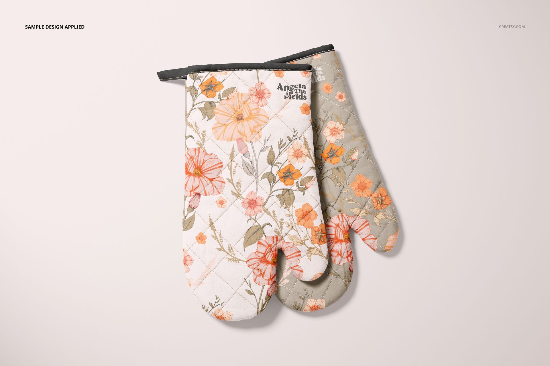 Floral-patterned oven mitt mockup set in soft orange and beige colors, arranged side by side on a neutral background.