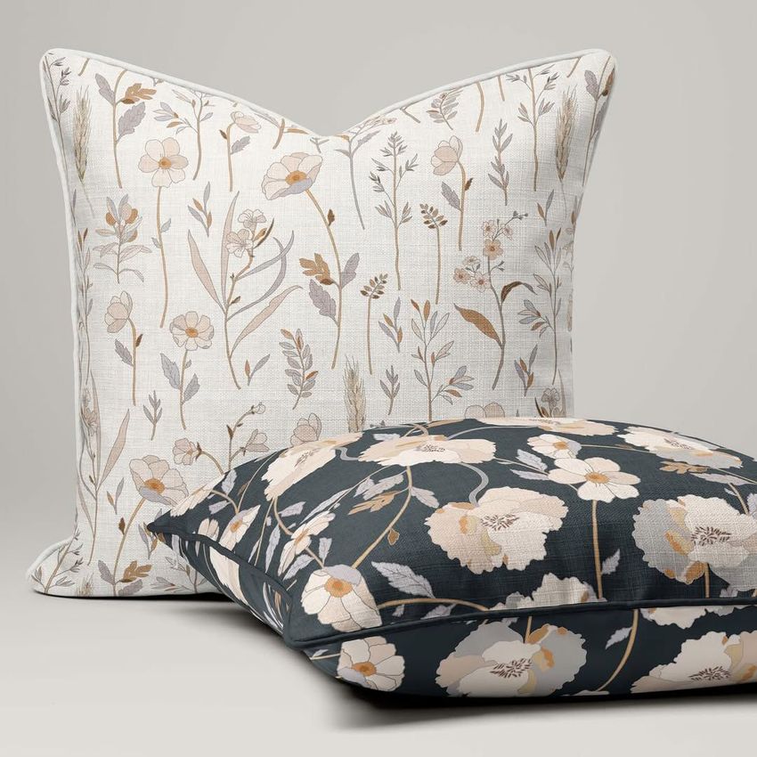 Reversible piped cushions mockup featuring two pillows, one with a light floral pattern and one with a dark floral design, on a neutral background.