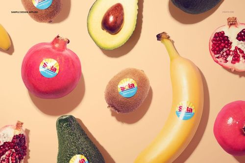 Round fruit sticker mockup featuring various fruits like kiwi, banana, avocado, and pomegranate on a light background.