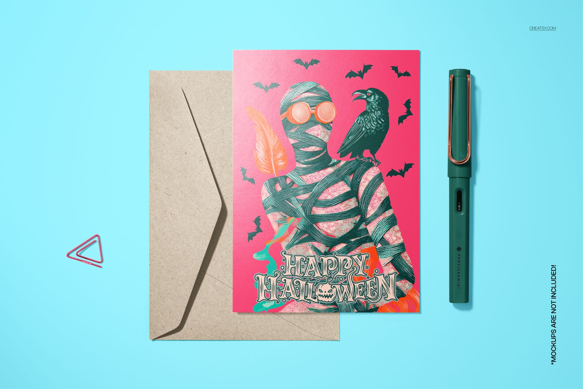 Halloween 5x7 card mockup with a mummy character, bats, raven, and envelope on a blue surface, vibrant colors.