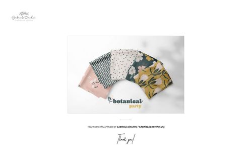 Folded fabric stack displayed in a fan arrangement, featuring various floral and geometric patterns on a white surface.