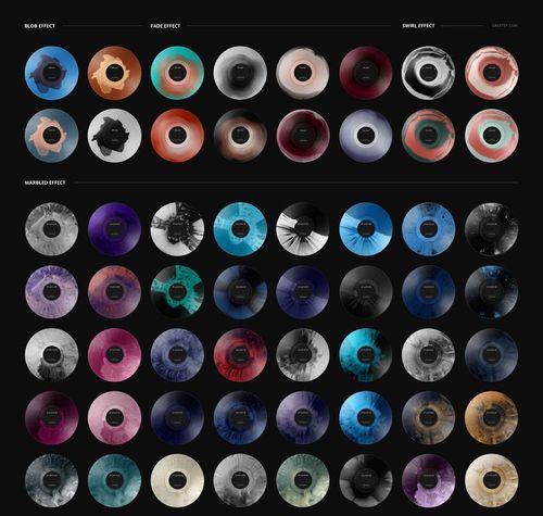 PSD mockup featuring several 7 inch colored vinyl records with unique translucent designs, viewed from above on a dark backdrop.