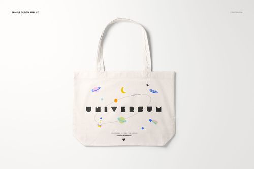 Front view of a weekender tote bag mockup with long handles, featuring a space-themed design on a light background.