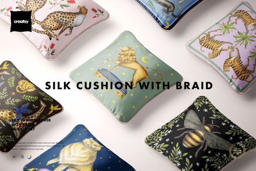 PSD mockup of square silk cushions with braided trim, decorated with colorful animal motifs, shown from above.