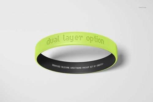 PSD mockup of a dual-layer silicone wristband featuring lime green exterior and black interior on a light background.