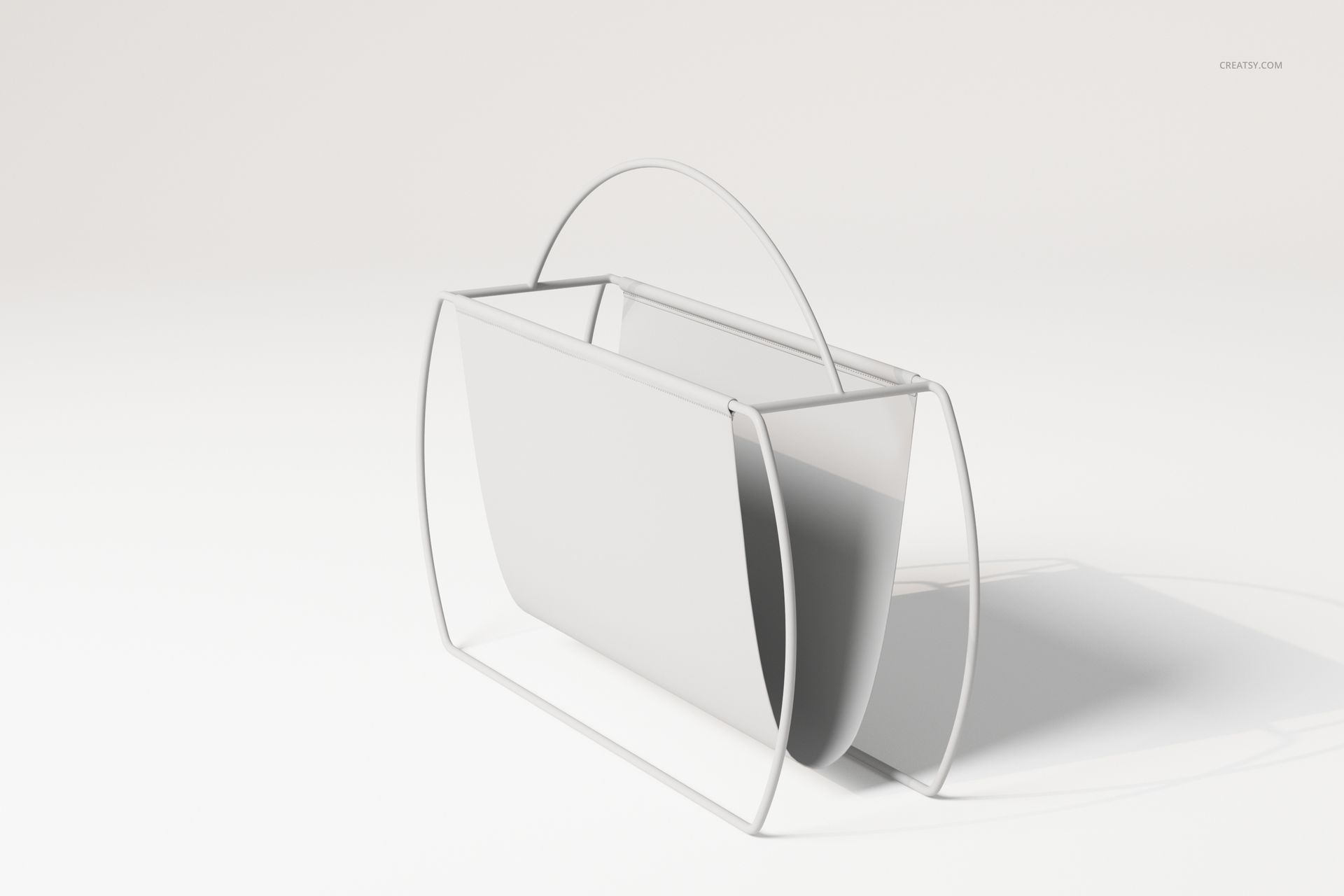 Free standing magazine rack with minimalist white metal frame and curved handle, shown on a plain light background.