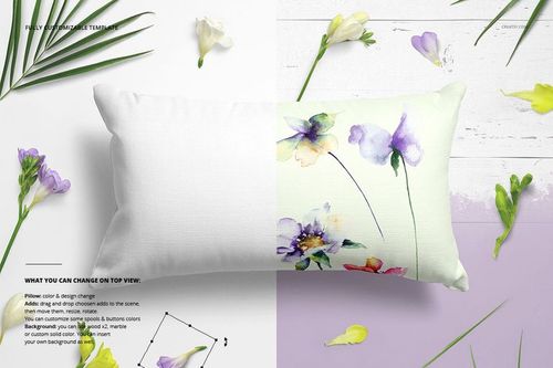 Top view of a rectangular pillow mockup featuring soft watercolor flowers on white fabric, surrounded by fresh blossoms.