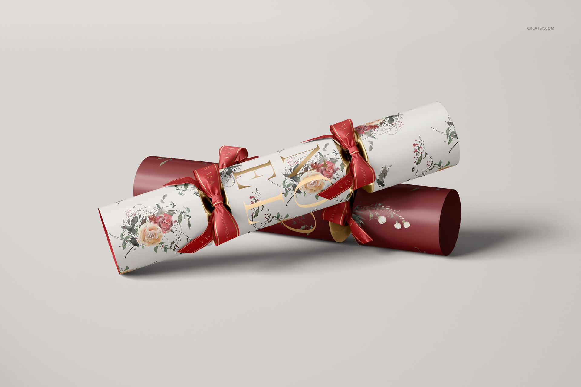 Front view of Christmas cracker mockup featuring red and white colors, floral designs, and decorative ribbons.