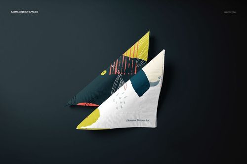 Mockup of two folded napkins with artistic designs, placed diagonally on a dark backdrop, emphasizing texture and color.