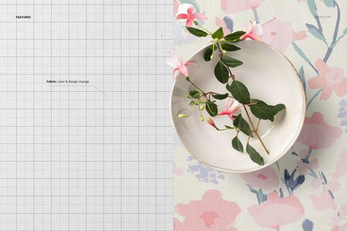 Top view of cotton fabric mockup with a soft floral pattern, featuring a white bowl with pink flowers on the right.