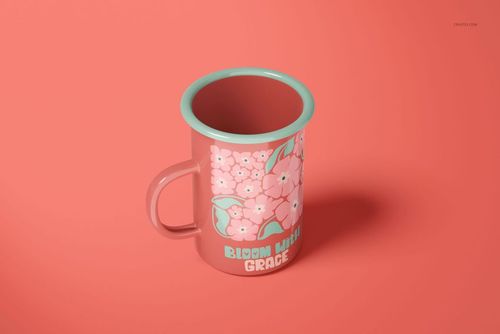 Enamel mug mockup featuring pink flowers and turquoise rim, displayed on a solid pink surface in top view.