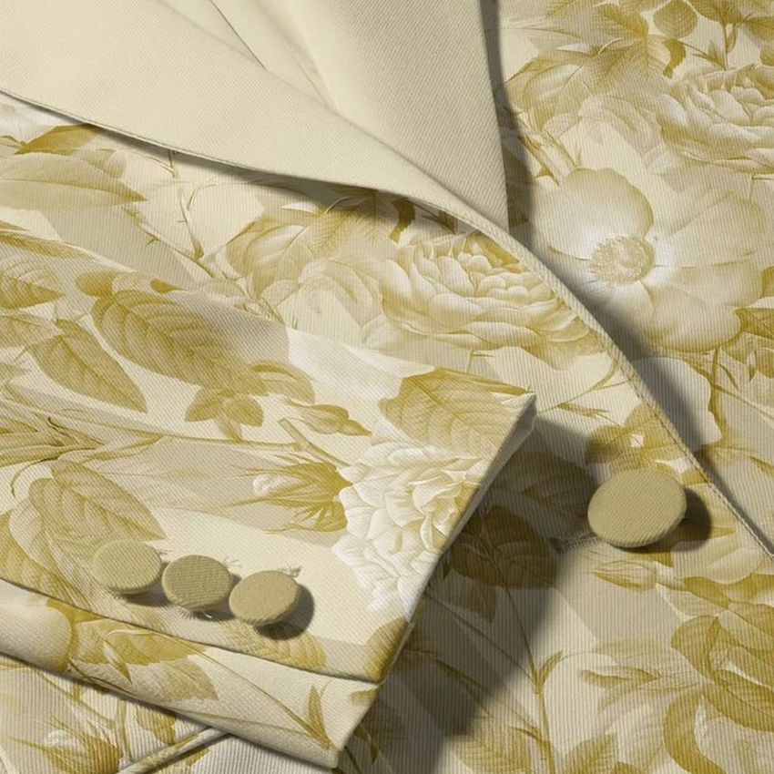 Close-up of a women's blazer mockup featuring a beige and cream floral pattern, showing lapel, sleeve, and buttons.