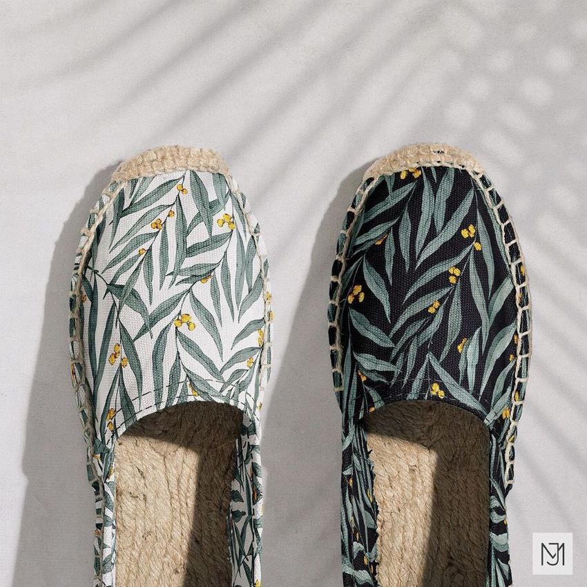 Canvas espadrilles mockup featuring two shoes with leafy and yellow berry patterns, one on a light background and one on a dark background.
